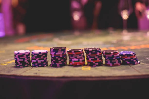 Live Sic Bo table with three dice in cage and betting layout displayed